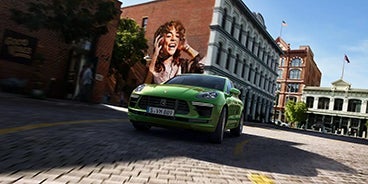 Blue Porsche Macan Turning a Corner in San Francisco CA